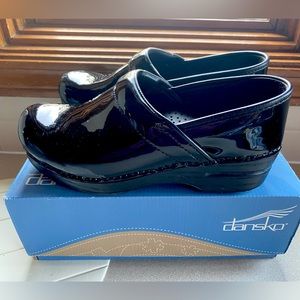 Dansko patent leather clogs